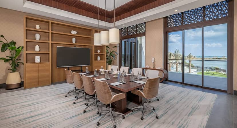 Luxury boardroom suite at Anantara Mina Al Arab for executive meetings and corporate strategy.