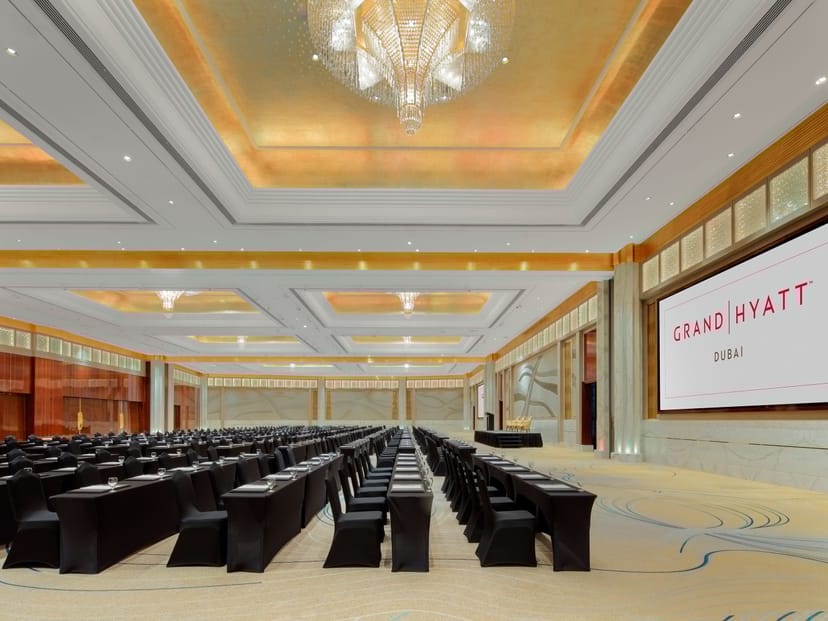 Grand Hyatt Dubai ballroom with classroom seating for corporate conferences and executive events.