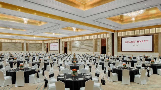 Grand Hyatt Dubai ballroom with banquet seating for large corporate galas and plenary events.