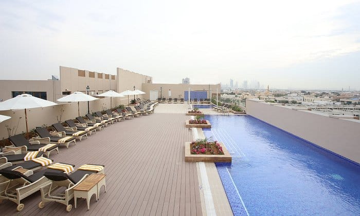 Rooftop pool at Metropolitan Hotel Dubai for evening receptions and networking events.