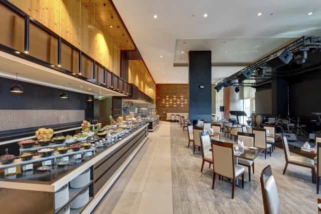 Buffet dining area at Metropolitan Hotel Dubai for corporate events and business meetings.