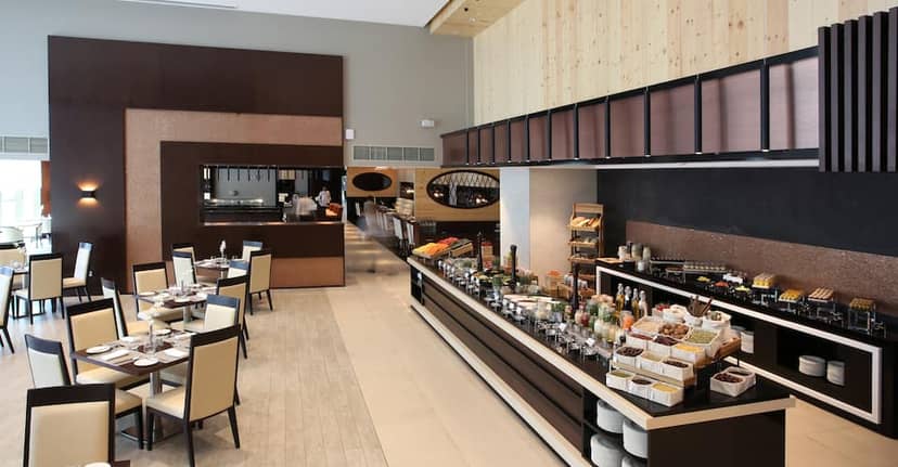 Modern hotel breakfast buffet at Metropolitan Dubai featuring sleek, efficient dining area.