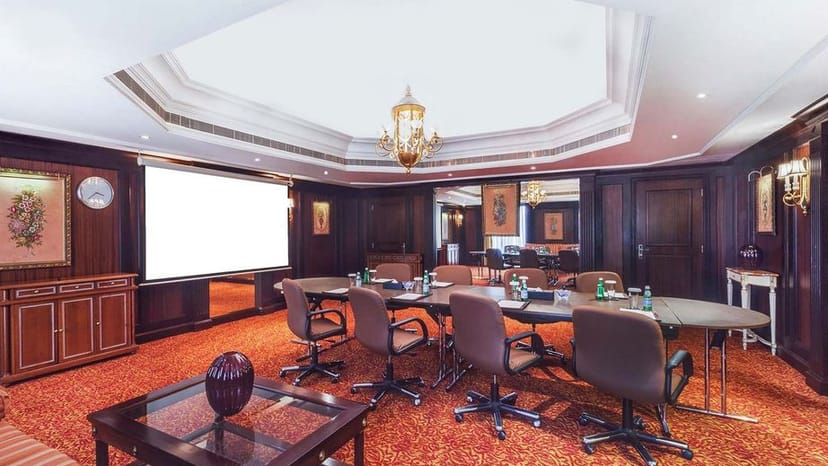Executive boardroom at Millennium Plaza Downtown Hotel, professional meeting space setup.