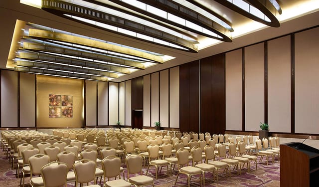 Swissotel Al Ghurair ballroom with theater-style seating for corporate conference and event venue.