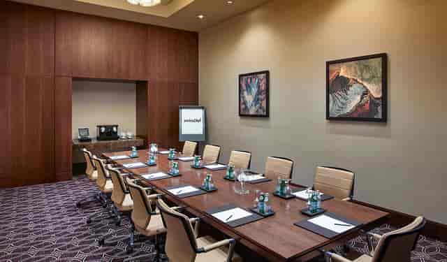 Boardroom meeting room with 12 seats at Swissotel Al Ghurair, ideal for professional conferences.