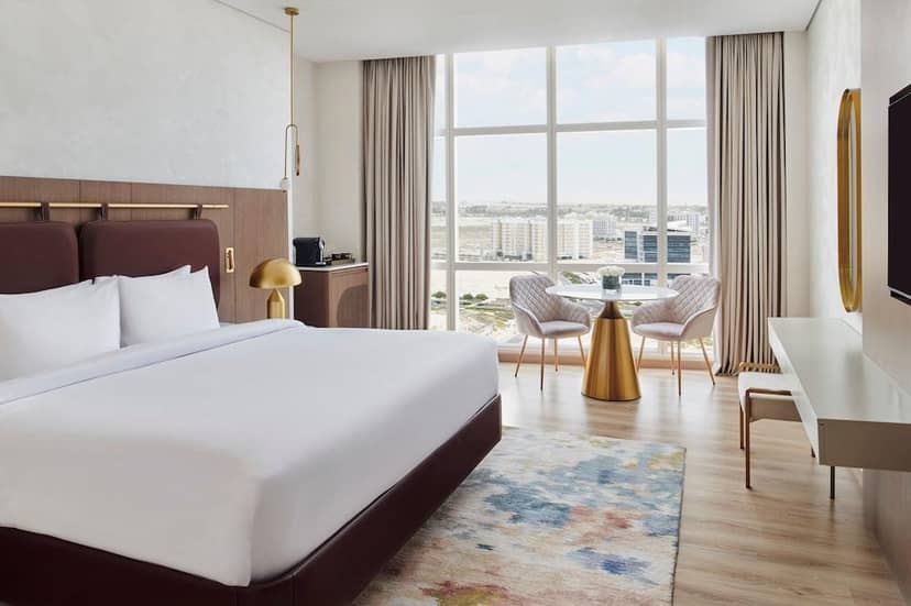 VIP guestroom at Al Khail Mövenpick Hotel with executive workspace for business travel.
