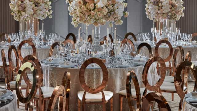 Mandarin Oriental Dubai ballroom with rose gold chairs for a luxury gala and corporate event.