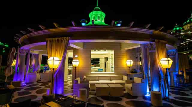 Villamoré rooftop lounge with elegant drapery, ideal for VIP networking and corporate events.