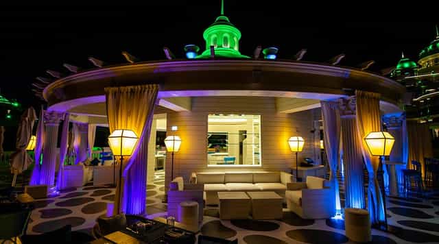 Villamoré rooftop lounge with elegant drapery, ideal for VIP networking and corporate events.