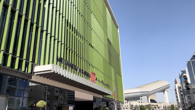 Modern Millennium Al Barsha hotel facade, eco-friendly venue for corporate incentive travel.