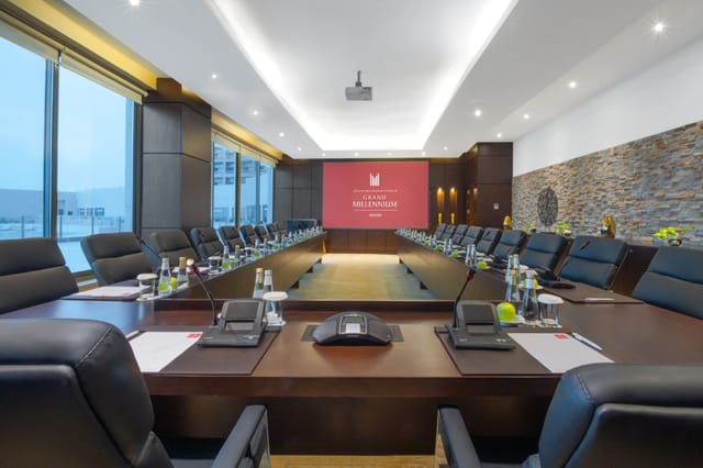 U-shaped boardroom at Millennium Airport Hotel Dubai for executive meetings and corporate events.