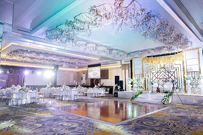 Al Garhoud Ballroom with Art Deco decor and floral installations for luxury wedding gala events.