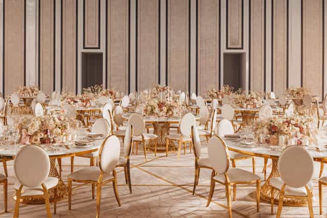 Luxury gala ballroom setup with gold accents, ideal for corporate dinners and upscale events.