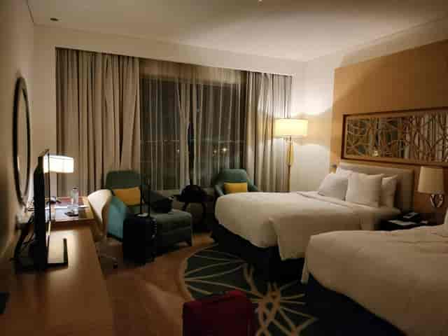 Safa 1 hotel room in Marriott Al Jaddaf featuring workspace for business conferences and events.