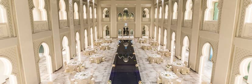 Luxury ballroom in Arjaan by Rotana Dubai with central water feature for gala dinners and events.