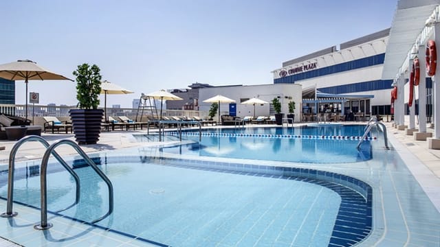 Rooftop pool deck at Crowne Plaza Dubai for corporate receptions and networking events.