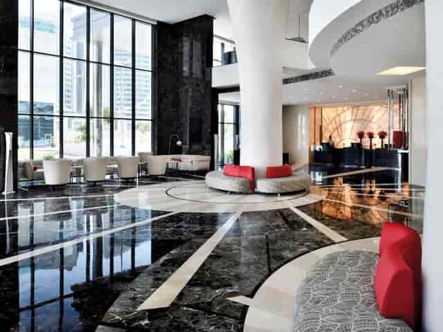 Modern hotel lobby with modular seating, ideal for corporate brand events and networking.