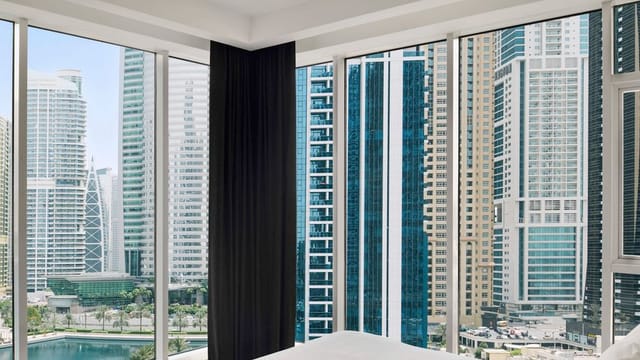 Executive meeting boardroom at Mövenpick Jumeirah with floor-to-ceiling city views.