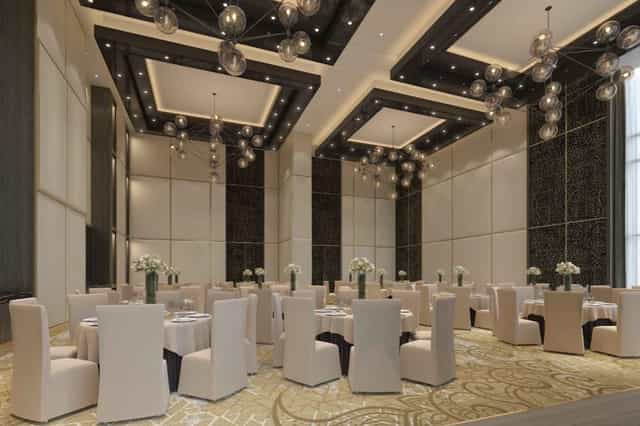 Luxury Taj Jumeirah ballroom with dramatic lighting for corporate galas and weddings.