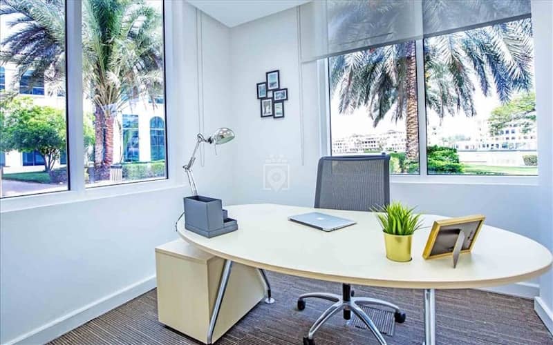 Modern private office with natural light for professional breakout sessions and client meetings.