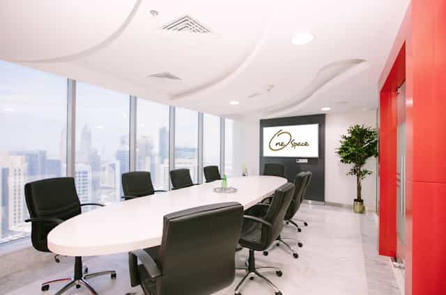 Boardroom-style meeting room with city views for executive corporate events and business meetings.
