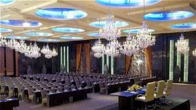 Schoolroom setup in Oud Metha ballroom with chandeliers, ideal for corporate events and conferences.