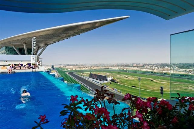 Infinity pool at Meydan Hotel with trackside views, ideal for luxury incentive travel events.