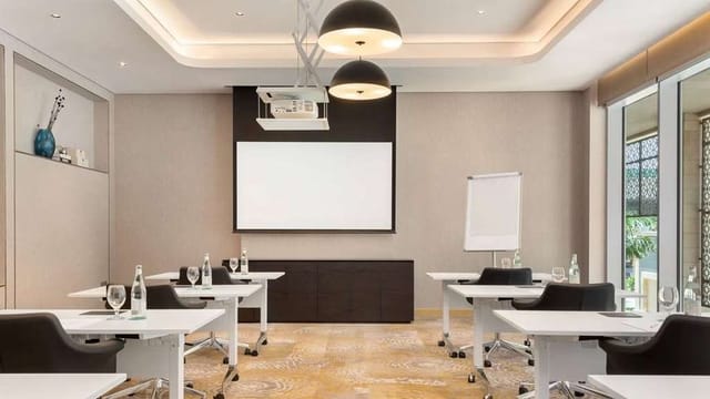 Classroom meeting room in Wyndham Dubai Deira with projector for corporate events.