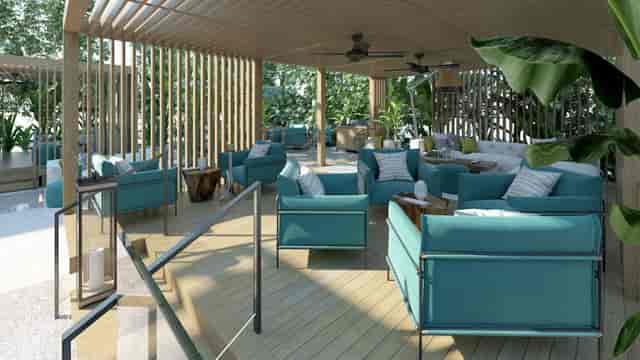 Modern outdoor lounge with teal seating for VIP networking and corporate breakout sessions.