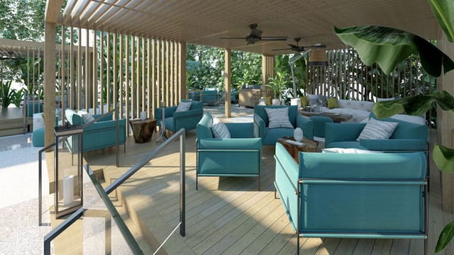 Modern outdoor lounge with teal seating for VIP networking and corporate breakout sessions.