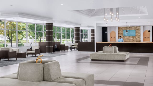 Meeting Room 3: Modern hotel event space with modular seating for professional conferences.