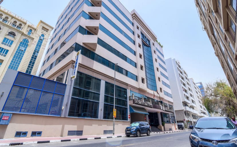 Landmark Summit Hotel suite, mid-rise architecture for corporate meetings and business travel.