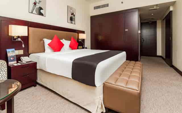 Upscale Landmark Summit Hotel conference delegate room with workspace for business travel.