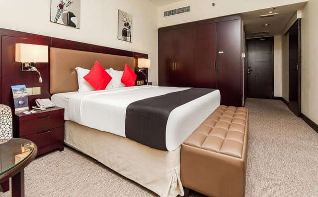 Upscale Landmark Summit Hotel conference delegate room with workspace for business travel.