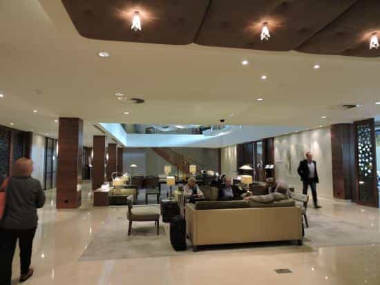 Spacious Hotel Okura Amsterdam lobby, ideal for corporate events and networking.