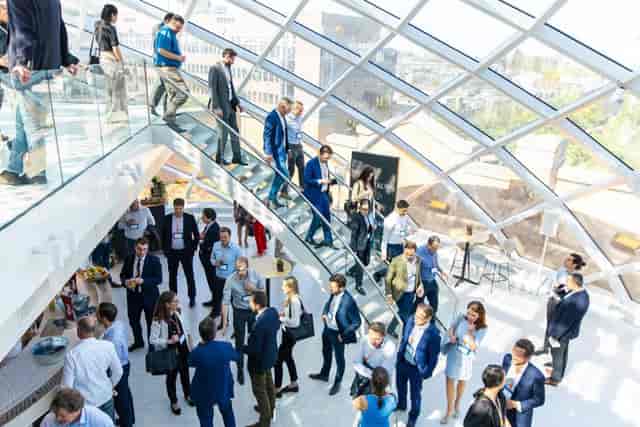 Vibrant networking event in modern conference space, Capital C Amsterdam, showcasing collaboration.