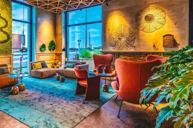 Stylish lounge at Four Elements Hotel Amsterdam, perfect for networking events and meetings.