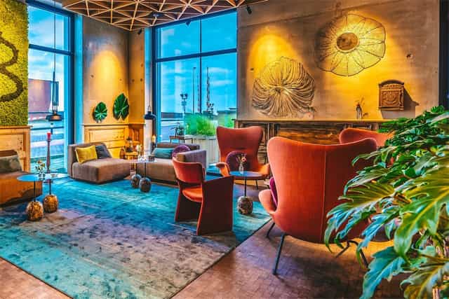 Stylish lounge at Four Elements Hotel Amsterdam, perfect for networking events and meetings.
