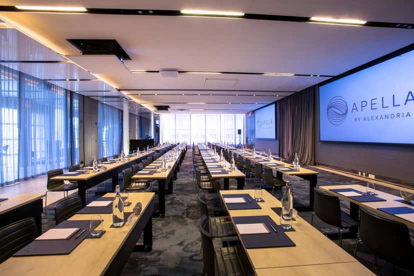 Modern conference room with AV setup, ideal for corporate meetings and workshops.