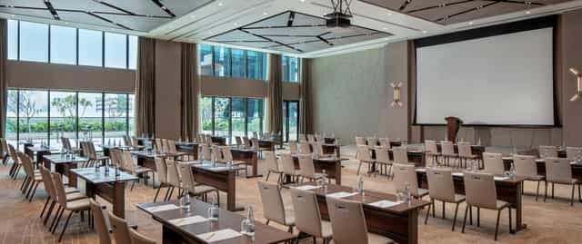 Menara Ballroom at DoubleTree Dubai, elegant conference room with natural light for events.