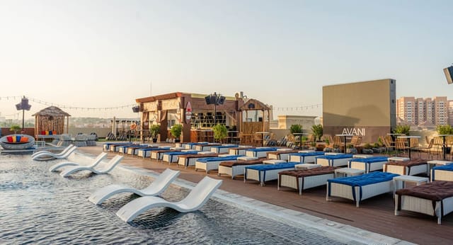 Avani Ibn Battuta rooftop venue with poolside seating for corporate events and incentive mixers.