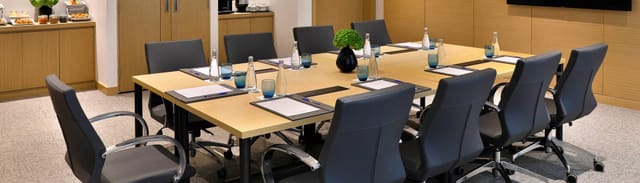 Professional boardroom setup at Avani Ibn Battuta Dubai Hotel for corporate meetings and events.