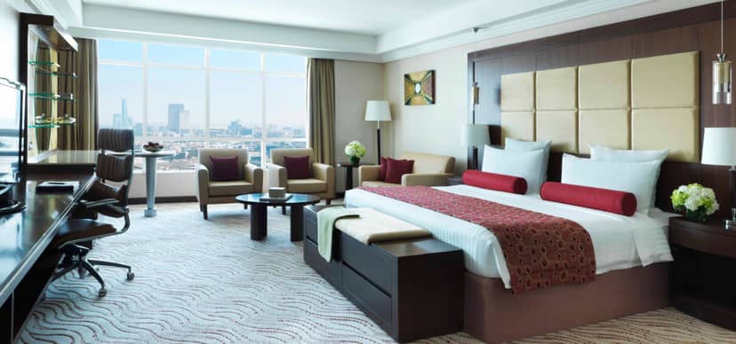 Premium executive guest room at Park Regis Kris Kin for business meetings and VIP events.