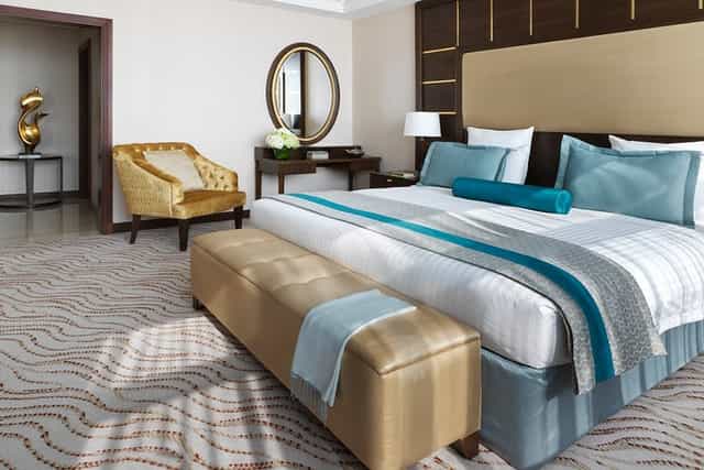 Upscale Park Regis Kris Kin hotel room for VIP event accommodation and luxury travel.