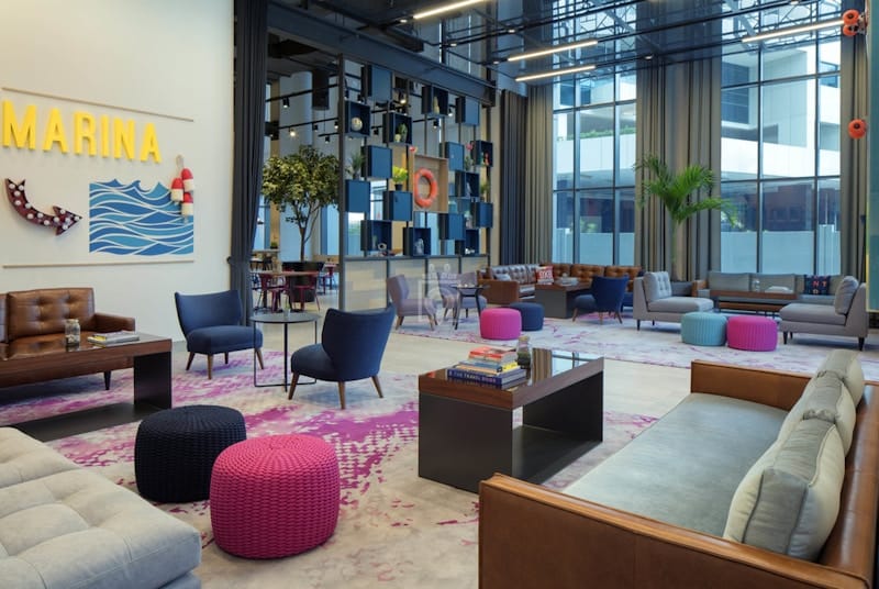 Modern co-working space with vibrant breakout areas for corporate networking and business events.