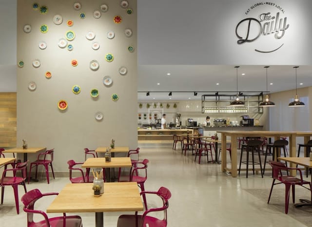 Modern coworking space at Rove JBR featuring flexible seating for networking and business events.