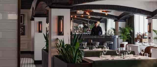 Luxury hotel suite bar for intimate corporate dinner or upscale networking event.