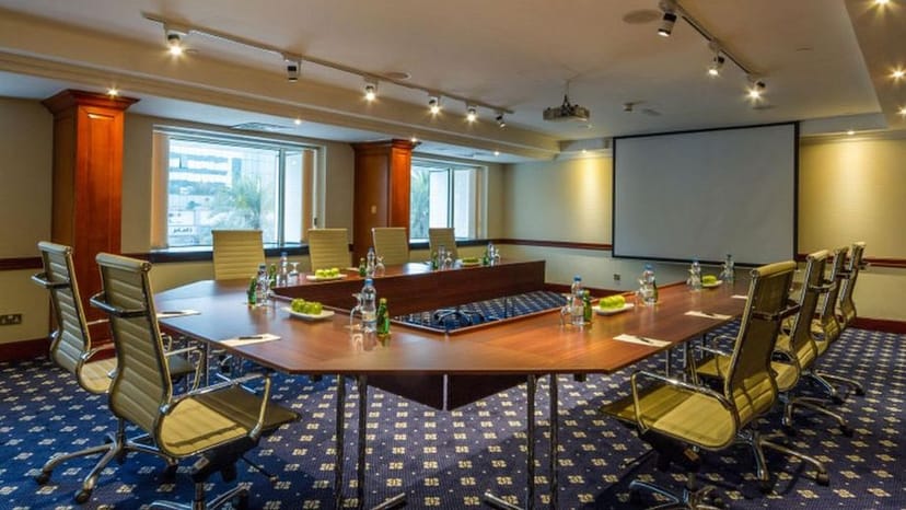 U-shaped boardroom at Grand Excelsior Hotel Deira for corporate meetings and business events.