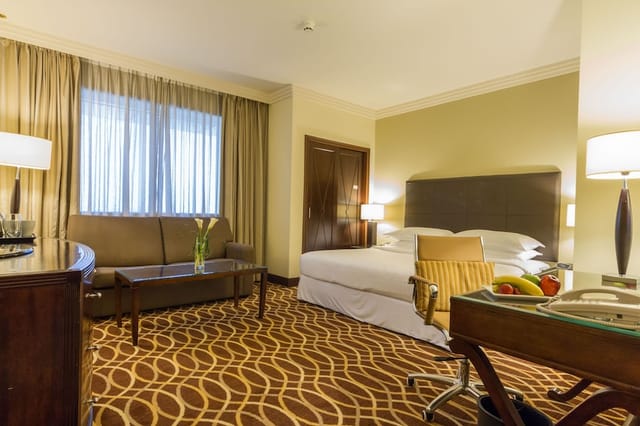 Grand Excelsior Deira meeting room with breakout space for business conferences and corporate events.