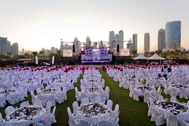Outdoor gala at Emirates Golf Club with city skyline view for corporate events and weddings.
